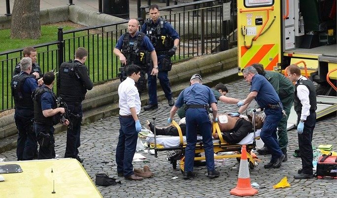 Emergency services at the scene outside the Palace of Westminster, London, after policeman has been stabbed and his apparent attacker shot by officers in a major security incident at the Houses of Parliament.